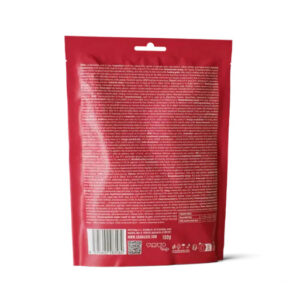 Back view of a red plastic package standing upright, with dense white text on the back, a barcode near the bottom left, and a hanging hole at the top; small icons along the bottom edge.