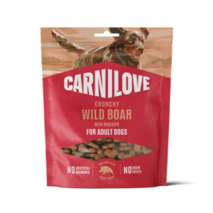 Carnilove Crunchy Wild Boar dog treats bag for adult dogs, red packaging with a running boar illustration and notes of no artificial colors or grains.