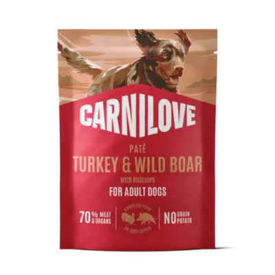 Red Carnilove dog food bag for adult dogs, turkey & wild boar pâté, with a dog illustration on top; highlights 70% meat & organs and no grain potatoes.