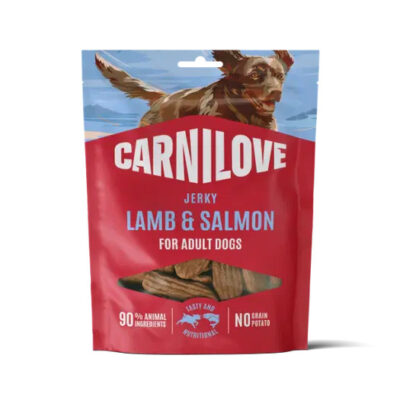 Carnilove Lamb & Salmon jerky bag for adult dogs; red package with a dog graphic and a window showing jerky sticks.