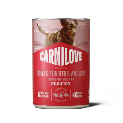Red Carnilove dog food can featuring a running dog and label 'Turkey & Reindeer & Wild Boar' for adult dogs