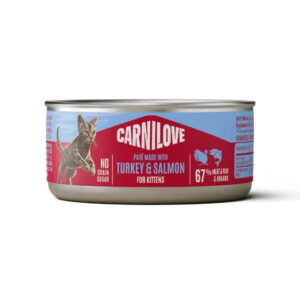Can of Carnilove kitten food labeled turkey and salmon, with a cat graphic on a pink-blue label and 67% meat claim