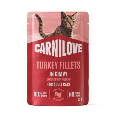 Carnilove Turkey Fillets in Gravy cat food for adult cats, pink/red packaging with a cat illustration on top.